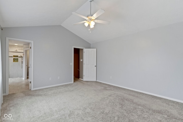 unfurnished bedroom with lofted ceiling, carpet, baseboards, and ceiling fan