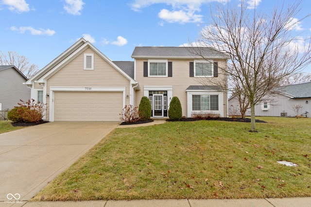 traditional-style house with a garage, driveway, and a front lawn