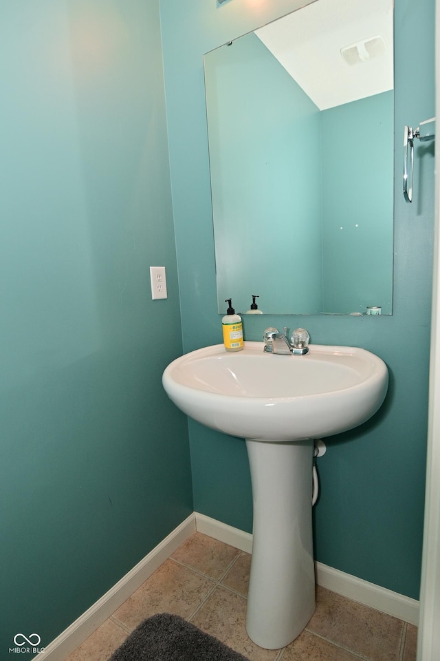 bathroom featuring tile patterned flooring and baseboards