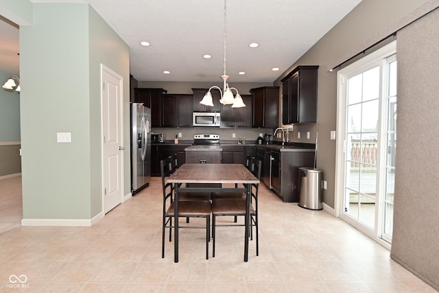 kitchen featuring a chandelier, dark brown cabinetry, recessed lighting, stainless steel appliances, and baseboards