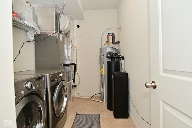 clothes washing area featuring laundry area and washer and clothes dryer