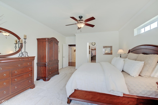 bedroom with light carpet, crown molding, and ceiling fan