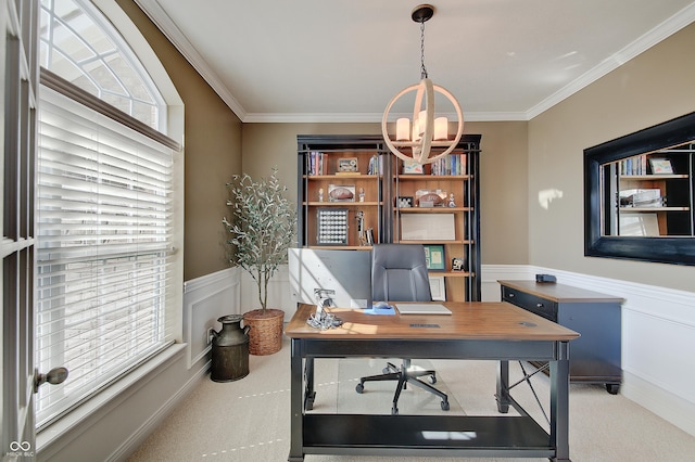 home office with a wainscoted wall, a notable chandelier, ornamental molding, and carpet flooring