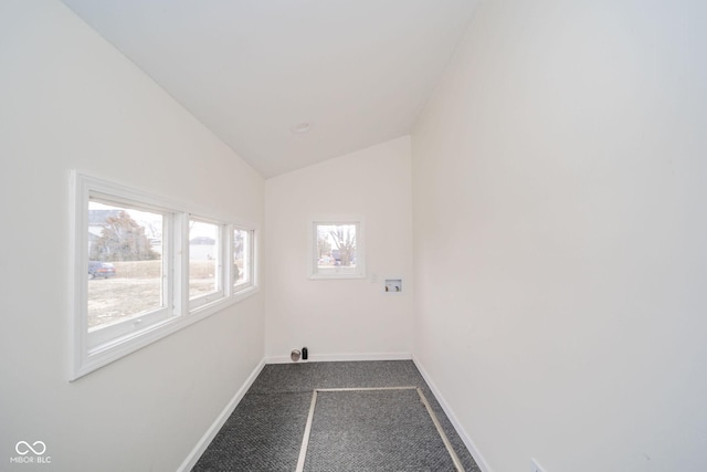 clothes washing area with dark colored carpet, laundry area, washer hookup, and baseboards