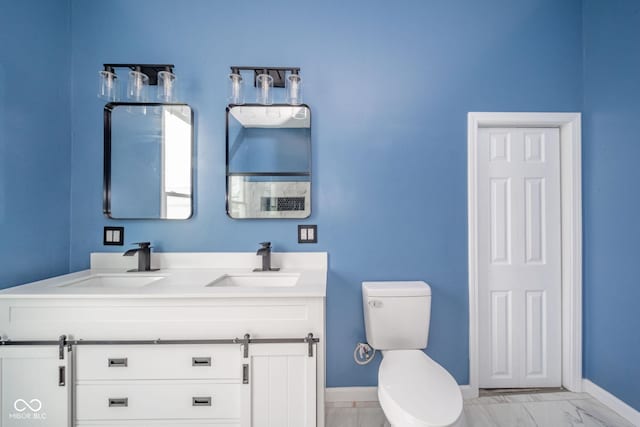 full bath with toilet, marble finish floor, baseboards, and a sink