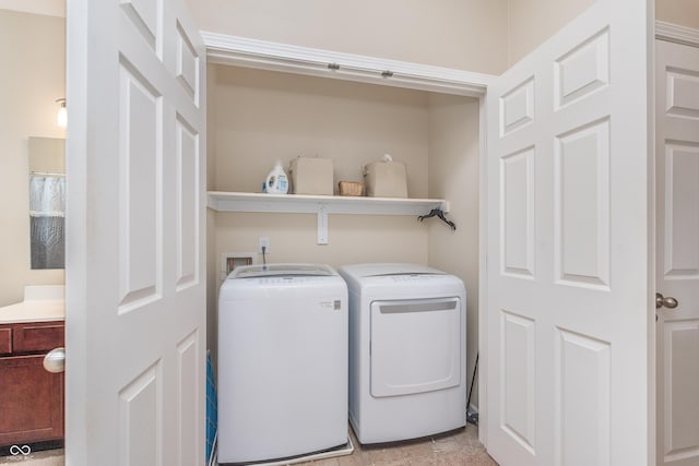 washroom featuring laundry area and separate washer and dryer