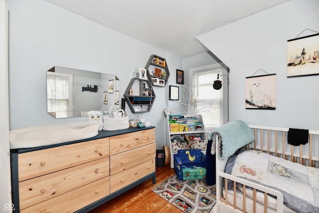 bedroom with wood finished floors