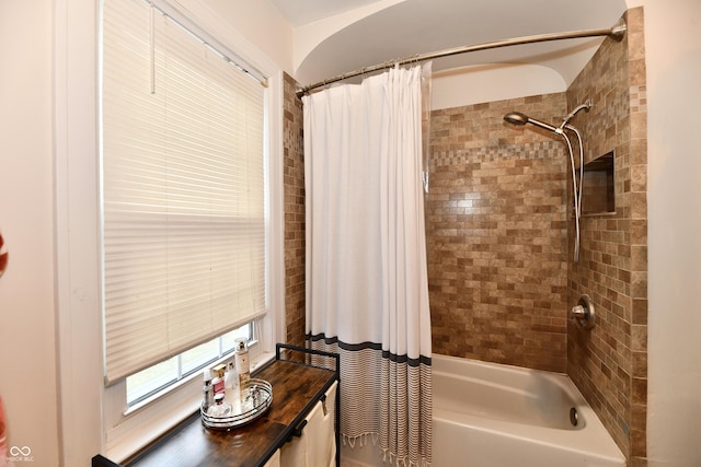 bathroom featuring shower / bath combo with shower curtain