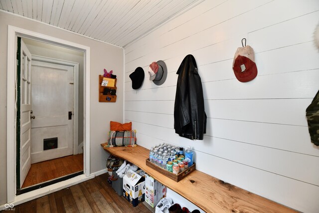 mudroom featuring dark wood-style flooring, wood ceiling, and baseboards