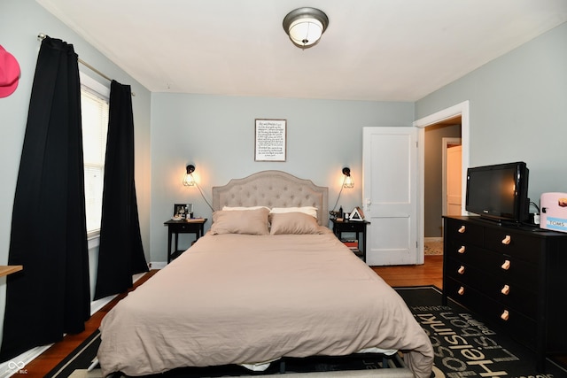 bedroom featuring dark wood-style floors