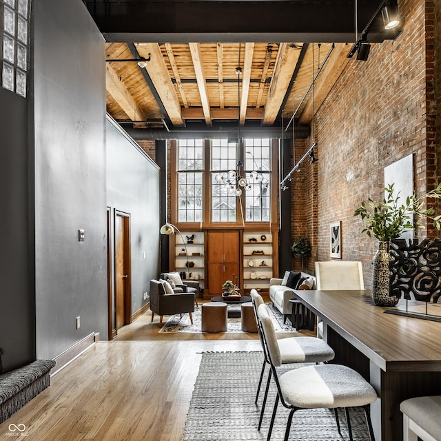 office area featuring wooden ceiling, a high ceiling, and wood finished floors