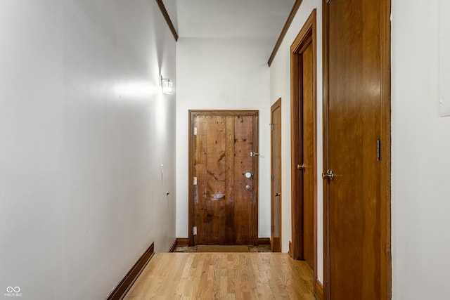 hallway featuring light wood-style flooring