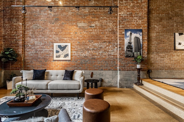 living room featuring brick wall