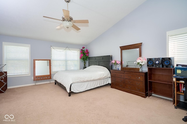 bedroom featuring a ceiling fan, lofted ceiling, baseboards, and carpet