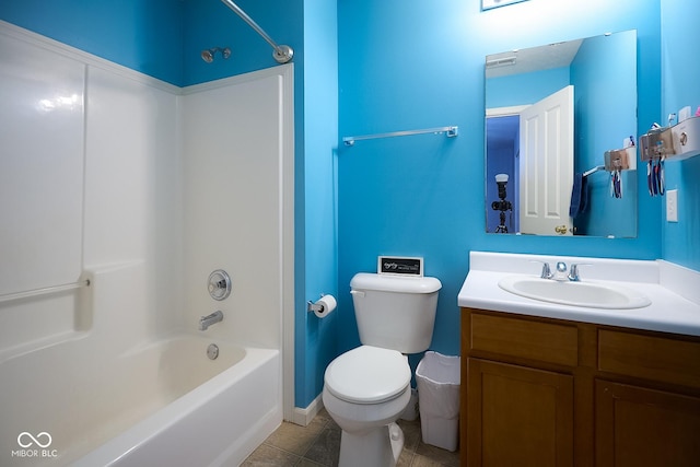 bathroom featuring toilet, shower / tub combination, tile patterned flooring, and vanity