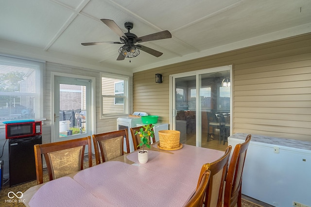 sunroom featuring a wealth of natural light and ceiling fan