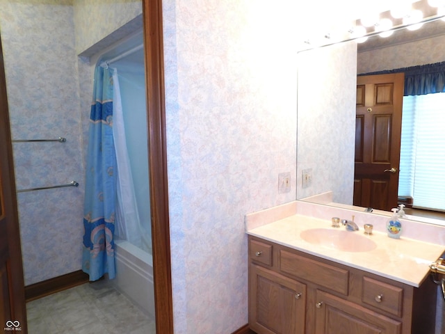 1229 E Tara Rd, Greensburg, IN 47240 - bathroom with vanity, wallpapered walls, and shower / bath combo