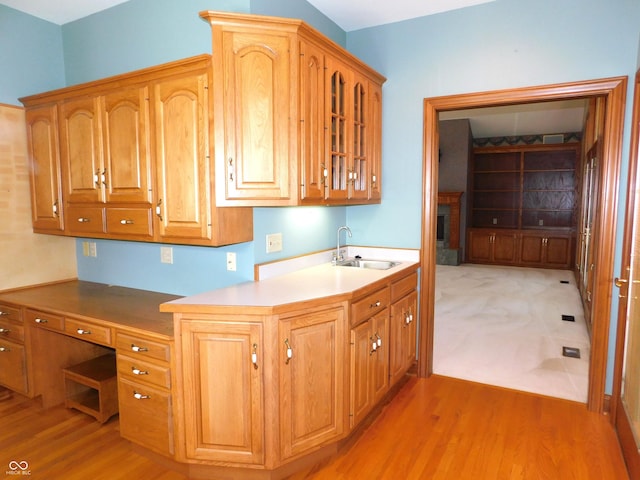 1229 E Tara Rd, Greensburg, IN 47240 - kitchen with light wood-style floors and glass insert cabinets