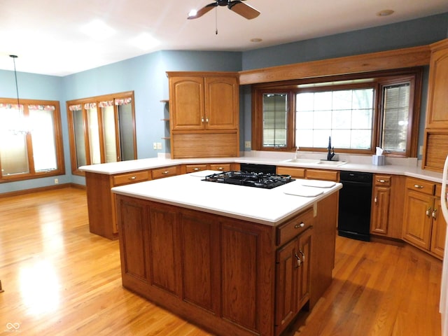 1229 E Tara Rd, Greensburg, IN 47240 - kitchen with black gas cooktop, a center island, a peninsula, and light countertops
