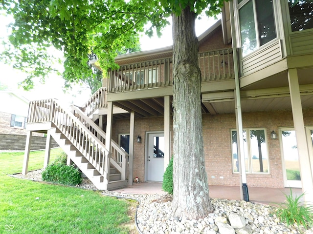 1229 E Tara Rd, Greensburg, IN 47240 - property entrance featuring brick siding and a yard