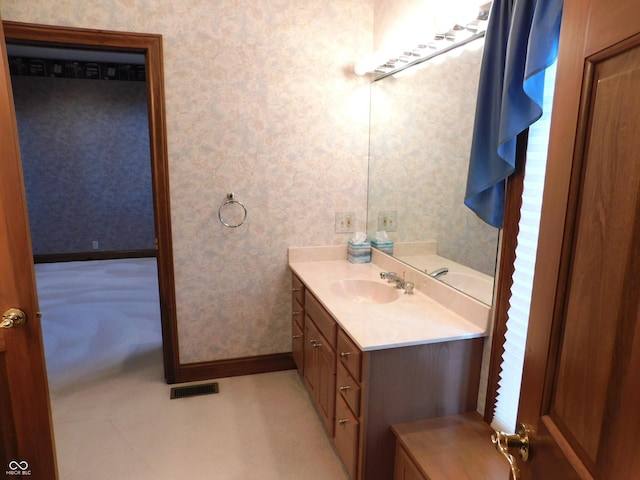 1229 E Tara Rd, Greensburg, IN 47240 - bathroom featuring wallpapered walls and vanity