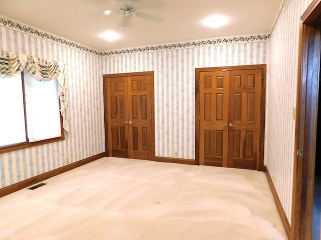 1229 E Tara Rd, Greensburg, IN 47240 - unfurnished bedroom with wallpapered walls and carpet