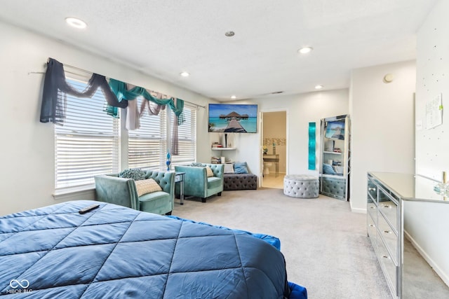 carpeted bedroom featuring baseboards, connected bathroom, and recessed lighting