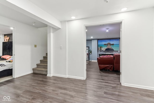 interior space featuring stairway, recessed lighting, wood finished floors, and baseboards