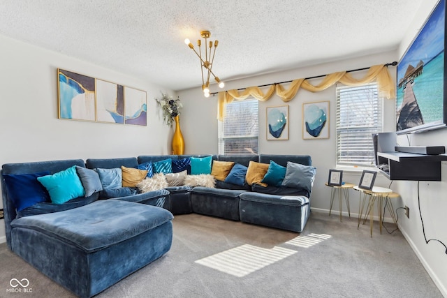 carpeted living area featuring a chandelier, a textured ceiling, and baseboards