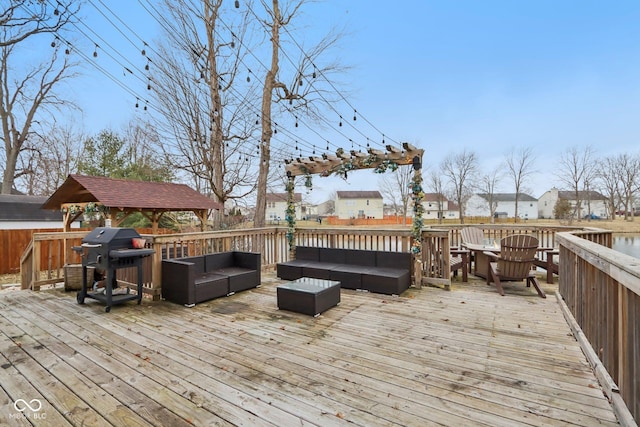 wooden terrace featuring grilling area and outdoor lounge area