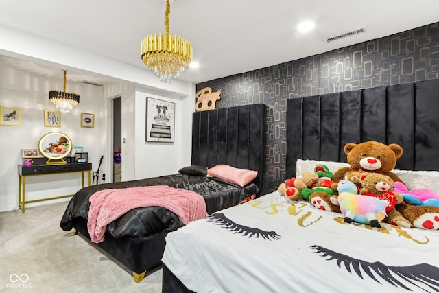 bedroom featuring a chandelier, an accent wall, carpet floors, visible vents, and wallpapered walls