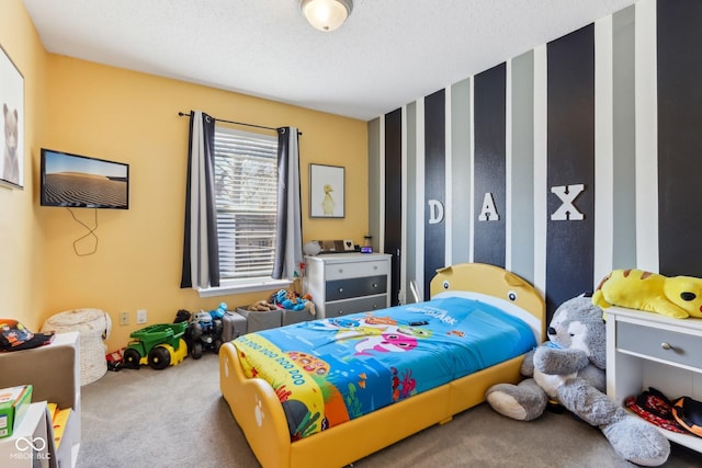 carpeted bedroom with a textured ceiling