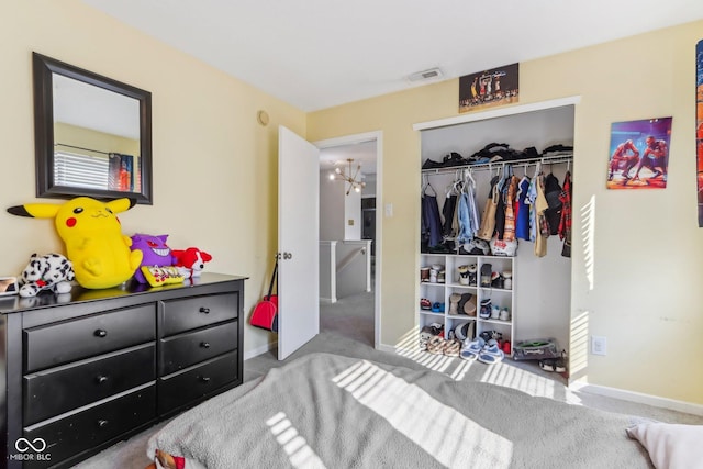 bedroom featuring baseboards, visible vents, a closet, and carpet flooring