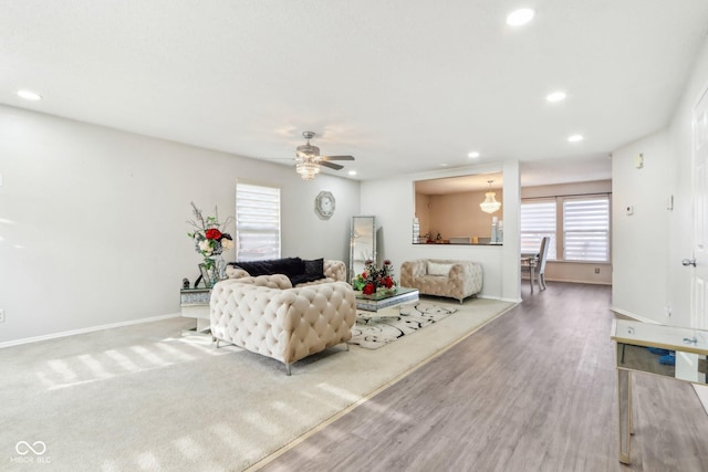 living room with a ceiling fan, baseboards, wood finished floors, and recessed lighting