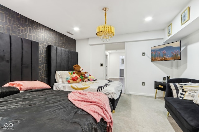 bedroom featuring baseboards, an accent wall, visible vents, and recessed lighting