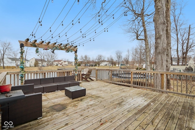 wooden deck with a residential view and an outdoor living space