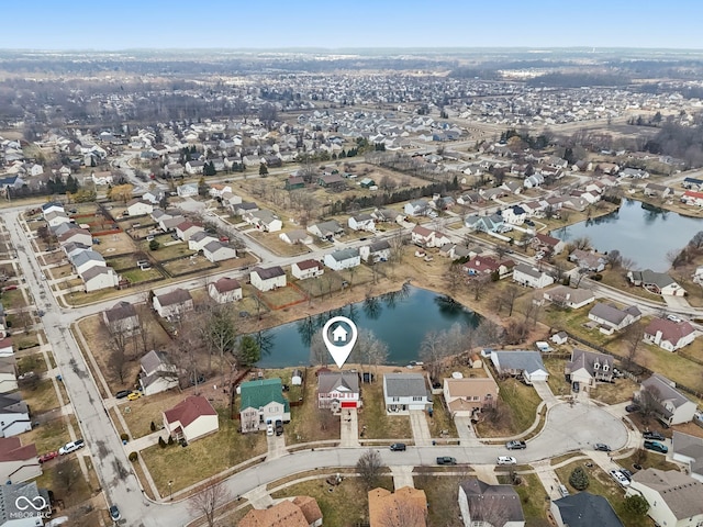 bird's eye view with a water view and a residential view