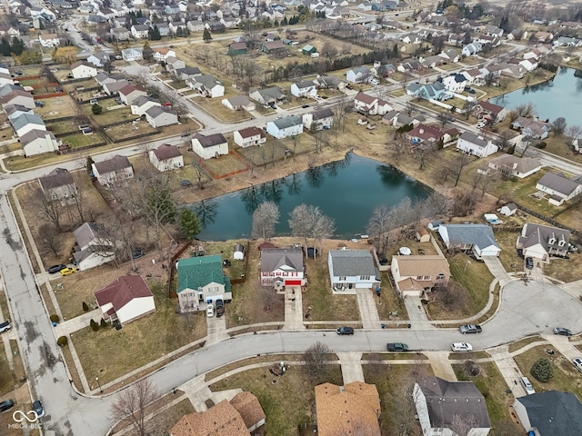 drone / aerial view featuring a water view and a residential view