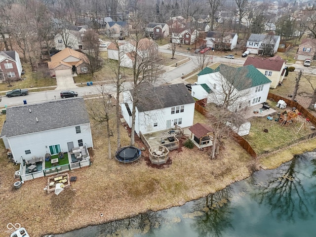 bird's eye view with a water view and a residential view