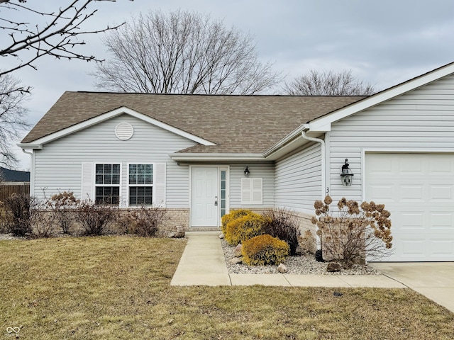 ranch-style house featuring a front lawn, roof with shingles, and an attached garage