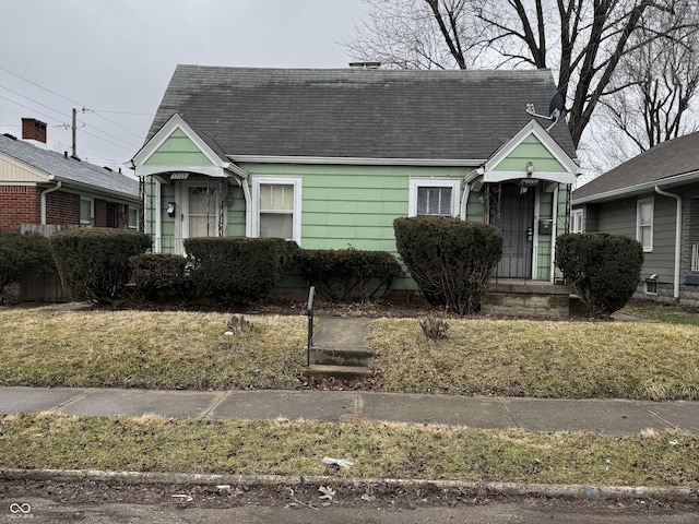 view of front of house featuring roof with shingles