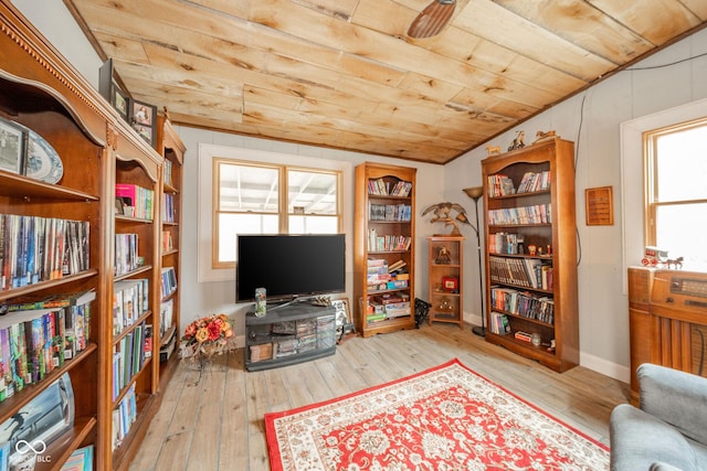 living area featuring wood ceiling, a healthy amount of sunlight, vaulted ceiling, and hardwood / wood-style flooring