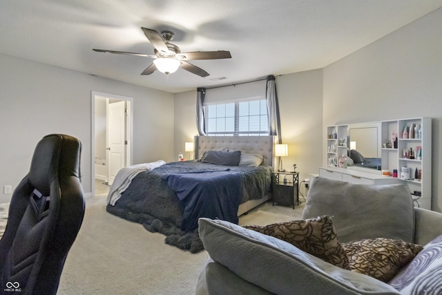 bedroom with light carpet, visible vents, connected bathroom, and a ceiling fan