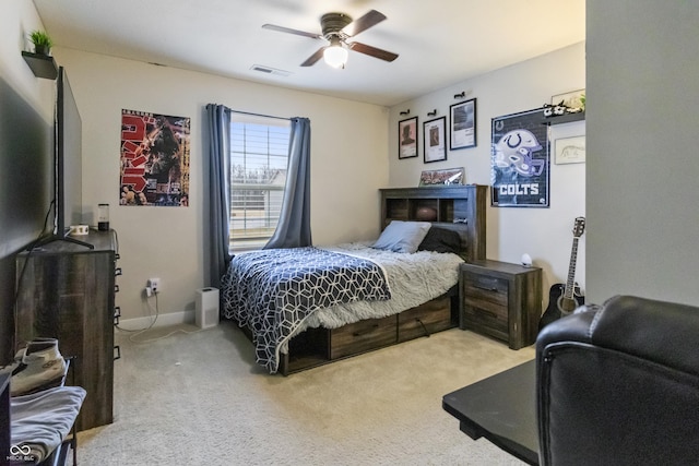 bedroom featuring light carpet, baseboards, visible vents, and a ceiling fan