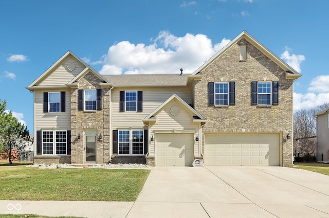 view of front facade with a front yard, brick siding, a garage, and driveway