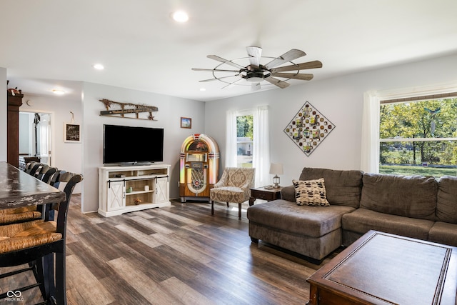 living room with dark wood finished floors, a ceiling fan, and recessed lighting