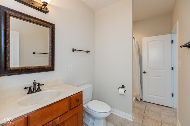 full bathroom featuring a shower with curtain, toilet, vanity, tile patterned flooring, and baseboards