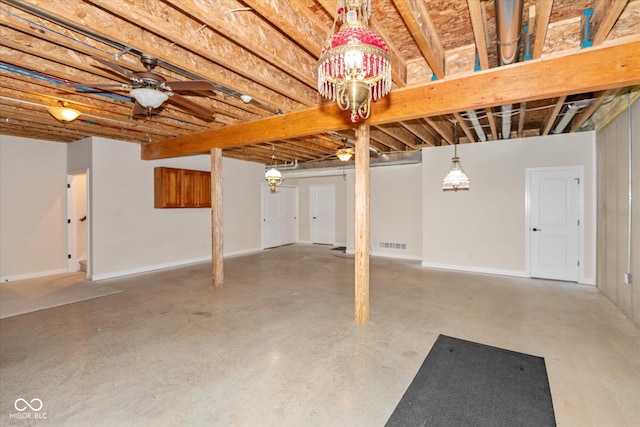 unfinished basement with ceiling fan, visible vents, and baseboards