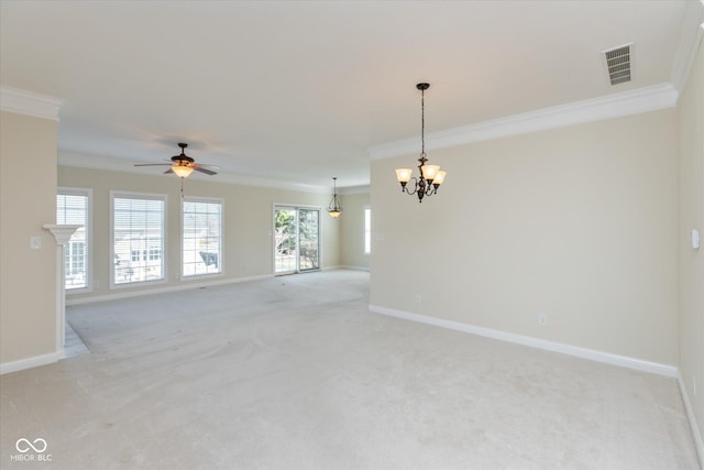 empty room featuring light carpet, visible vents, and crown molding