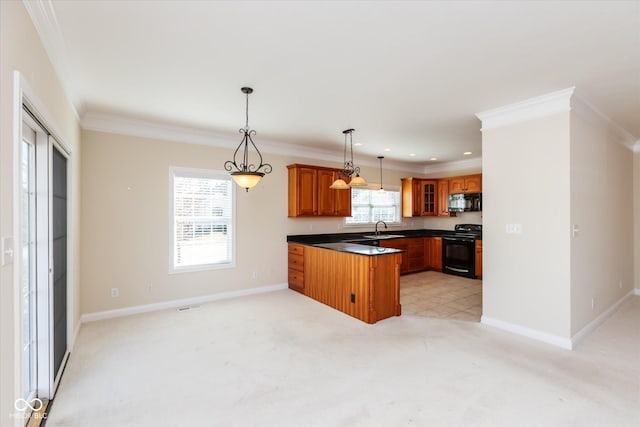 kitchen with a sink, black appliances, brown cabinetry, dark countertops, and glass insert cabinets